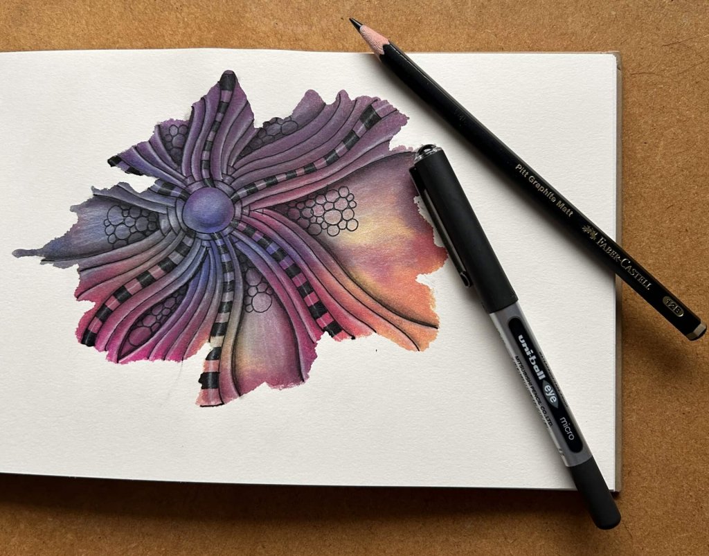 7 ways to improve your art blog post by Lisa Crow, CZT. Image shows a tile with some watercolour paint splashed on it and then decorated with Zentangle® patterns.